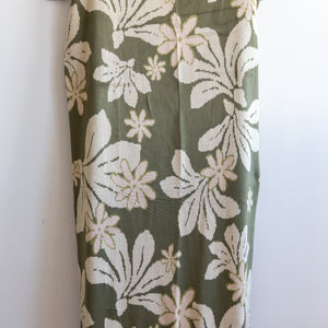 green cotton throw blanket with naupaka print