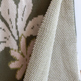 green cotton throw blanket with naupaka print