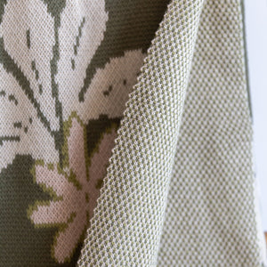 green cotton throw blanket with naupaka print