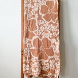 tan/nude woven cotton blanket featuring puakenikeni print
