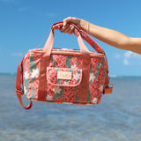 green cooler bag with tiare and red ginger floral pattern