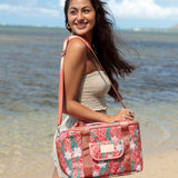 green cooler bag with tiare and red ginger floral pattern