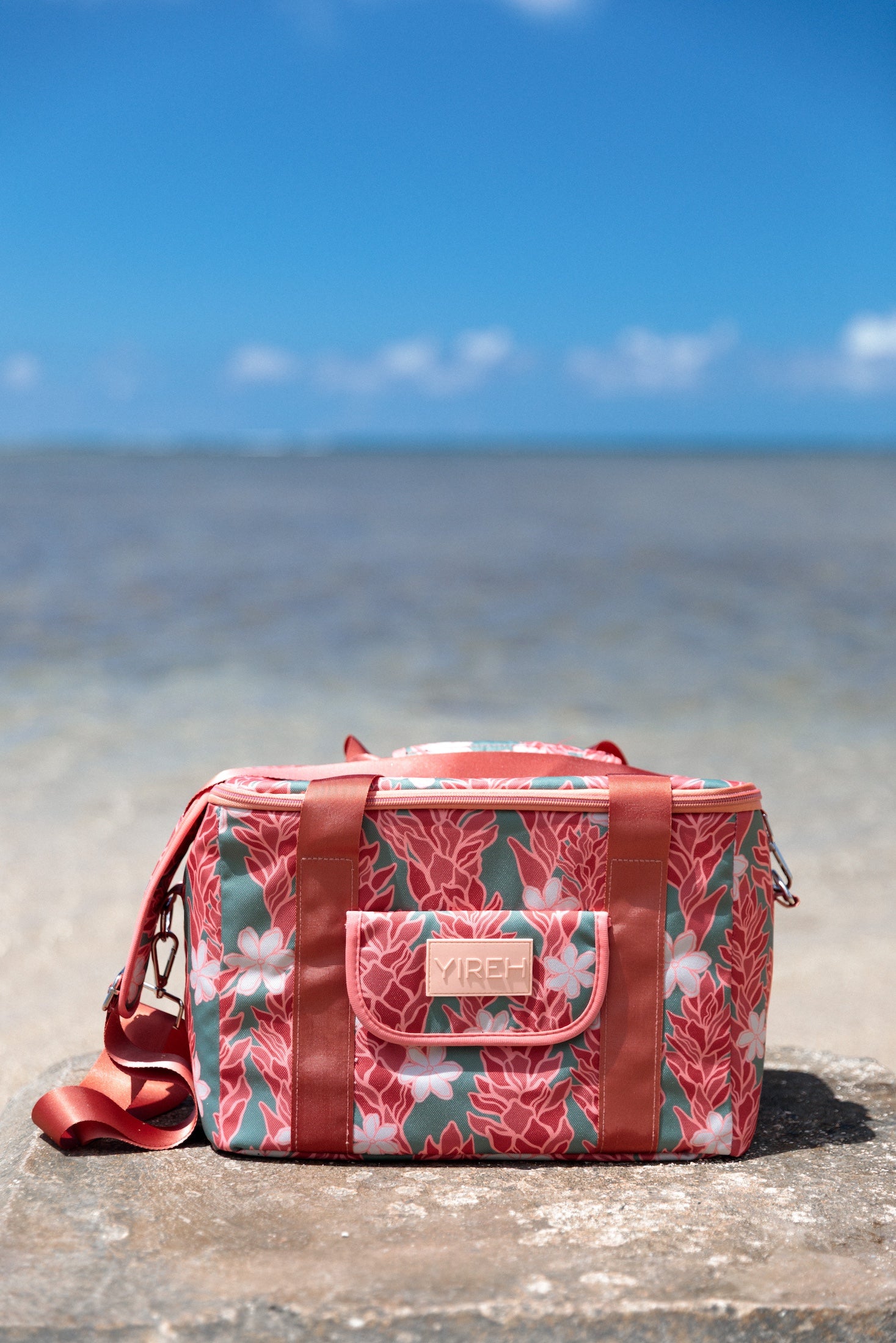 green cooler bag with tiare and red ginger floral pattern