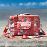 green cooler bag with tiare and red ginger floral pattern