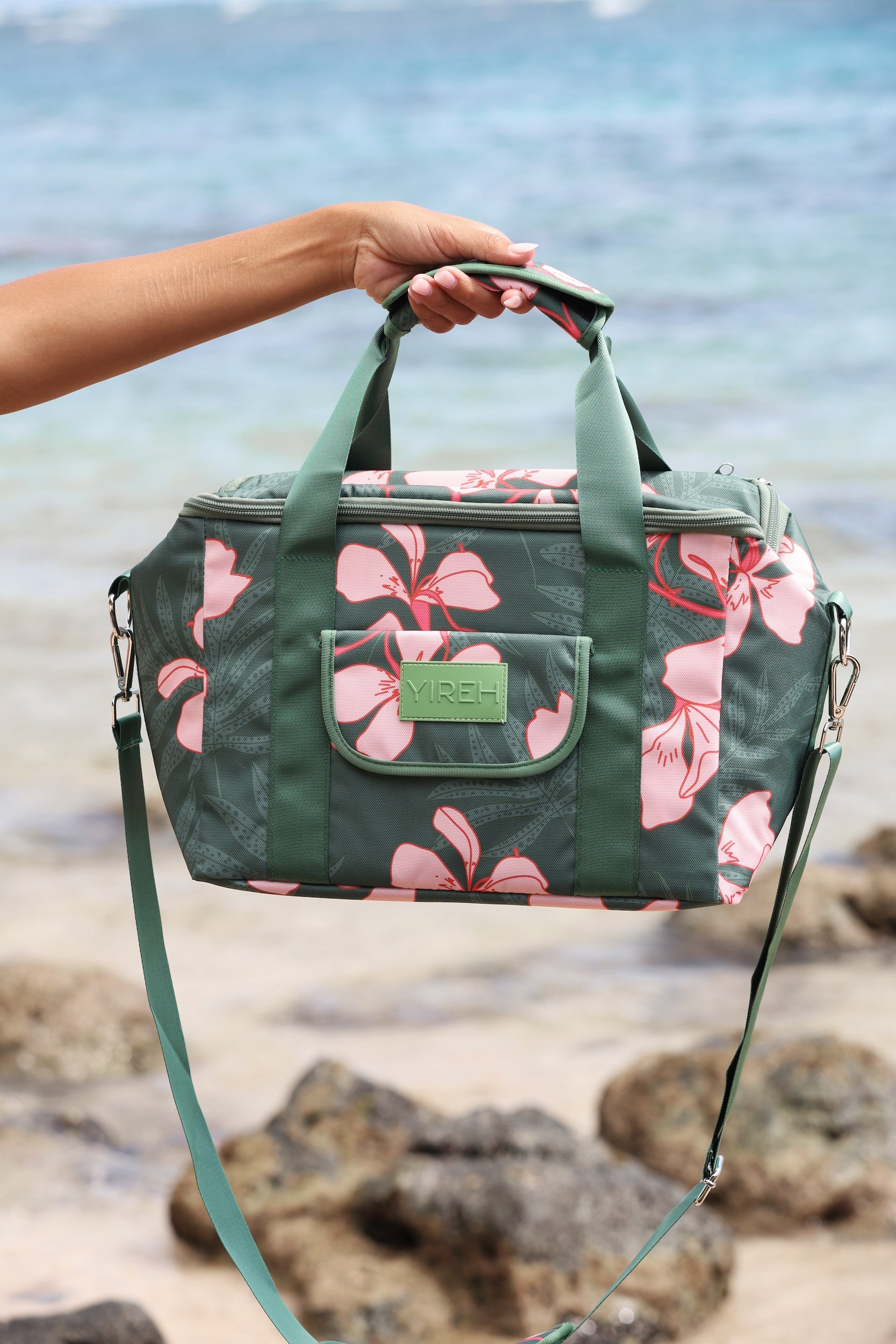 large forest green cooler bag with handle and strap featuring fern and ginger print