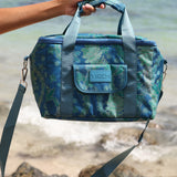 large cooler bag in blue green color with lei pattern featuring straps and handle