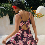 woman wearing dark purple mini dress with tie back detail with orchid print