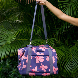 navy blue large travel tote with luggage sleeve, adjustable strap, duster bag, detachable mini pouches, and zipper compartments.