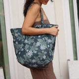 green nylon tote bag with naupaka and tiare print
