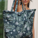 green nylon tote bag with naupaka and tiare print
