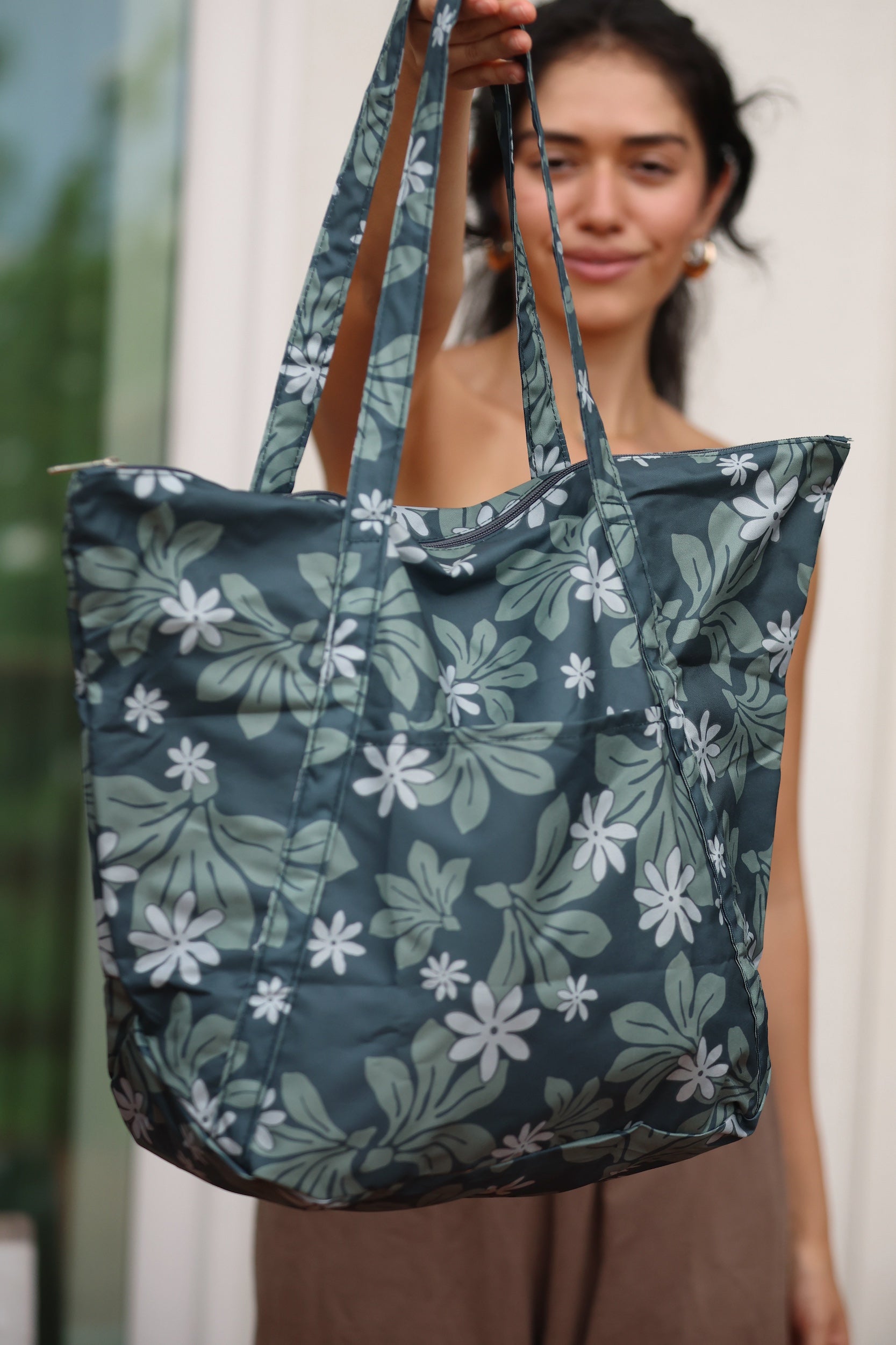 green nylon tote bag with naupaka and tiare print