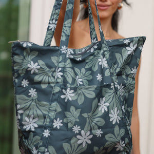green nylon tote bag with naupaka and tiare print