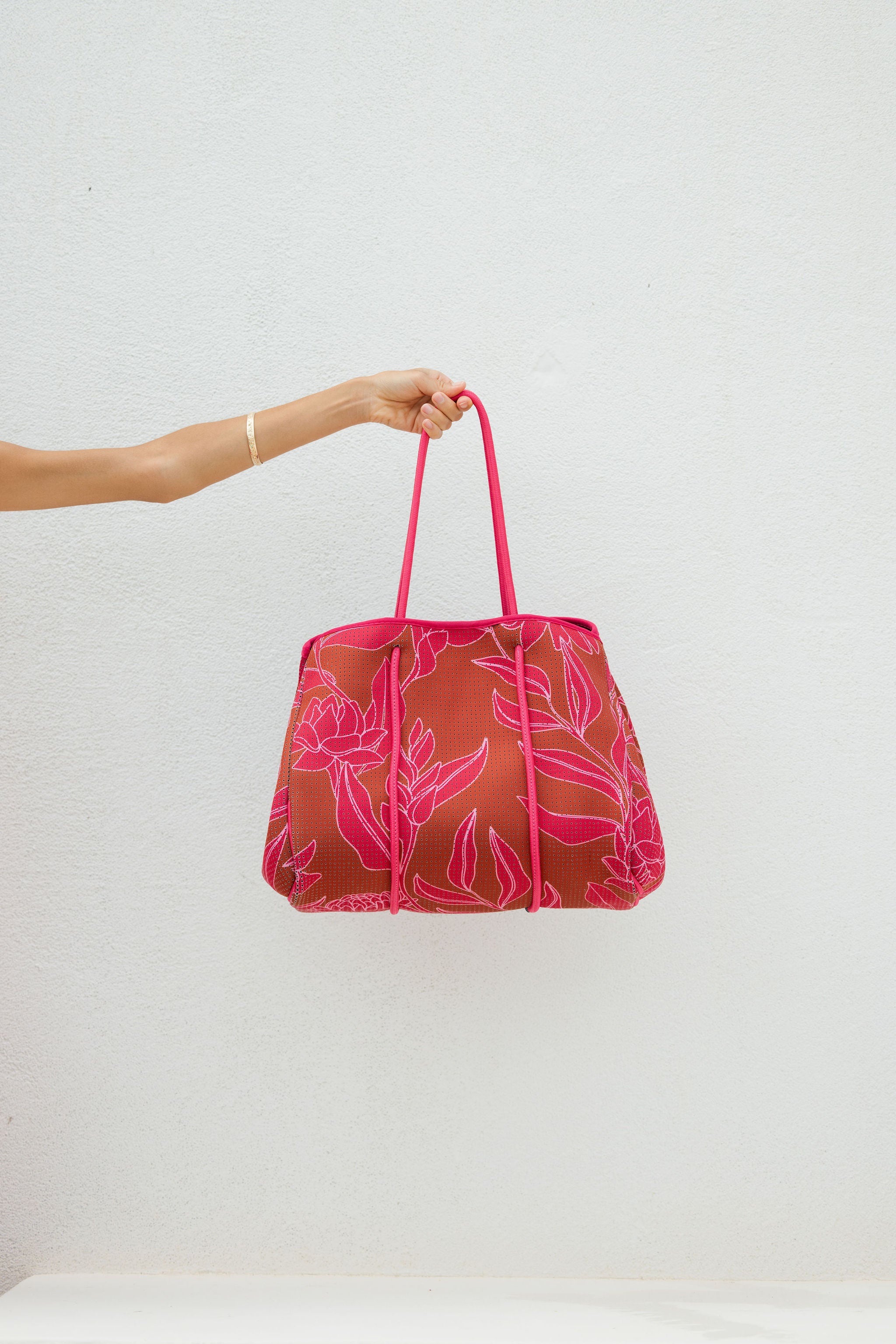 large neoprene tote bag and matching pouch in rusty brown and pink awapuhi print 