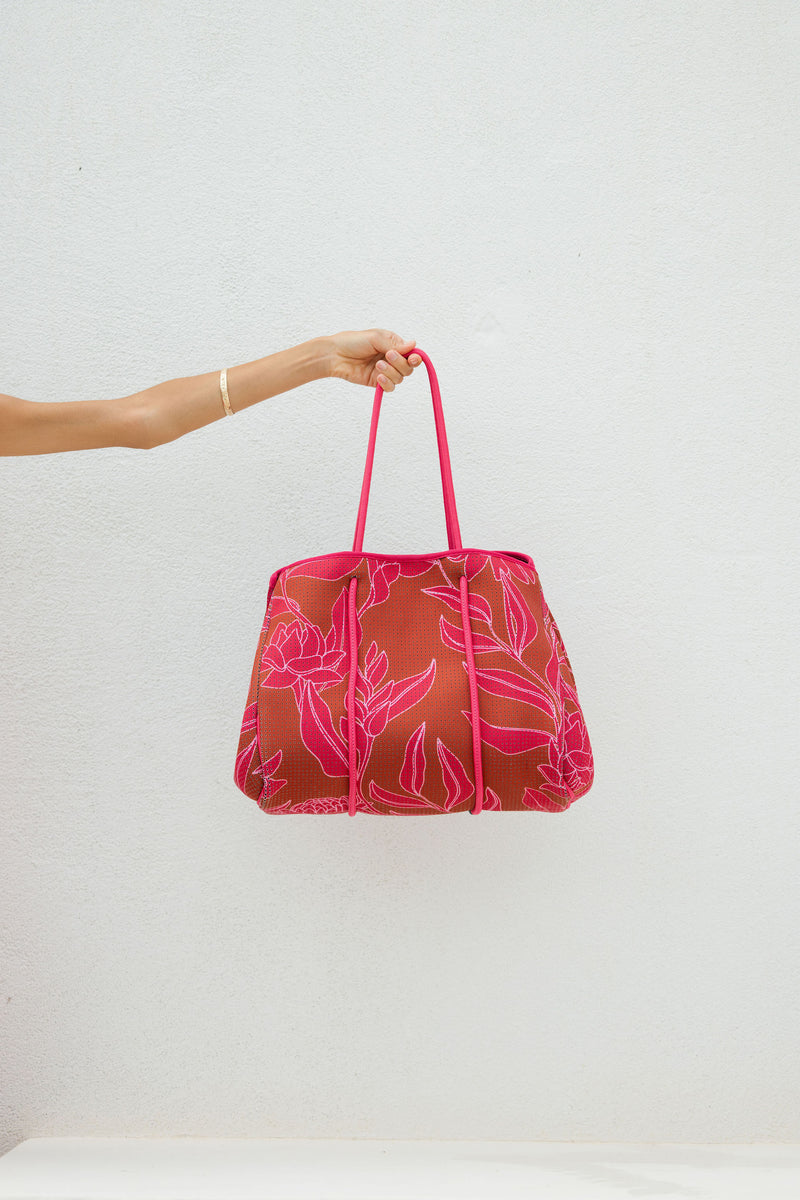 large neoprene tote bag and matching pouch in rusty brown and pink awapuhi print 