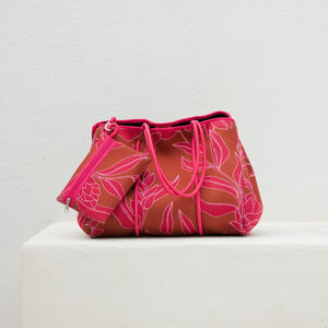 large neoprene tote bag and matching pouch in rusty brown and pink awapuhi print 