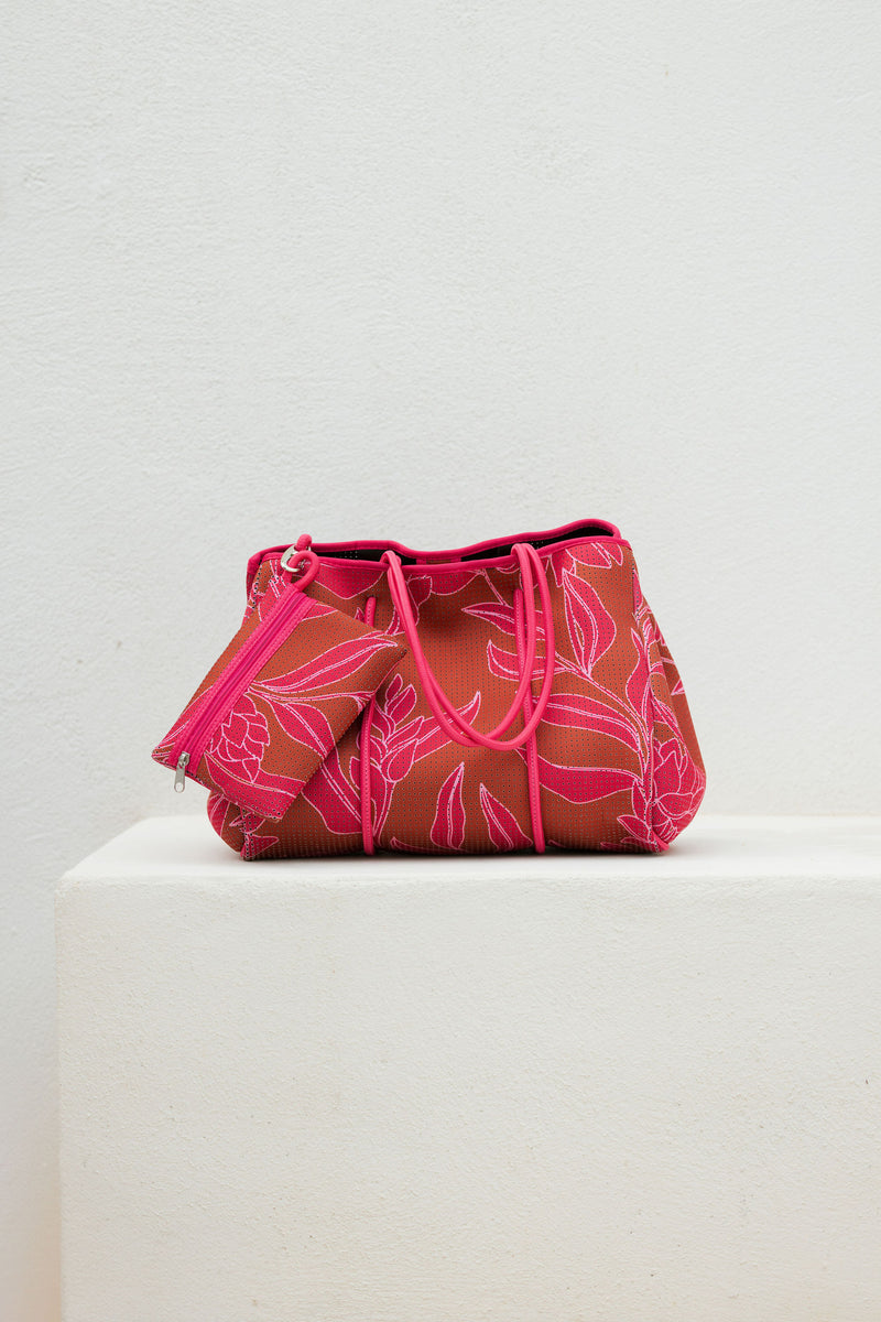 large neoprene tote bag and matching pouch in rusty brown and pink awapuhi print 