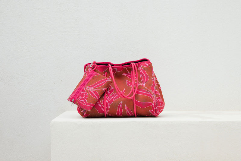 large neoprene tote bag and matching pouch in rusty brown and pink awapuhi print 