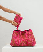 large neoprene tote bag and matching pouch in rusty brown and pink awapuhi print 