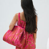 large neoprene tote bag and matching pouch in rusty brown and pink awapuhi print 
