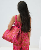large neoprene tote bag and matching pouch in rusty brown and pink awapuhi print 
