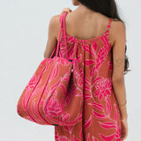 large neoprene tote bag and matching pouch in rusty brown and pink awapuhi print 