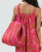 large neoprene tote bag and matching pouch in rusty brown and pink awapuhi print 