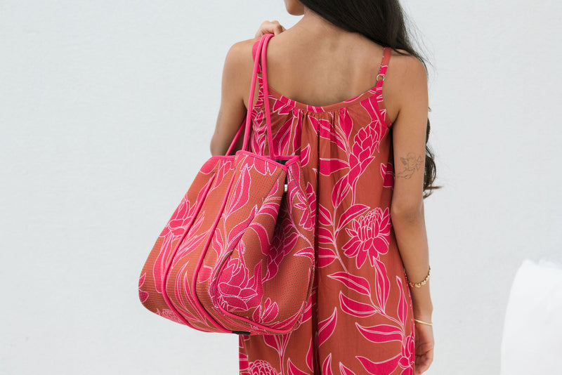 large neoprene tote bag and matching pouch in rusty brown and pink awapuhi print 