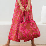large neoprene tote bag and matching pouch in rusty brown and pink awapuhi print 