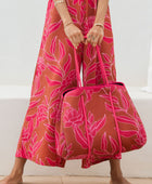 large neoprene tote bag and matching pouch in rusty brown and pink awapuhi print 
