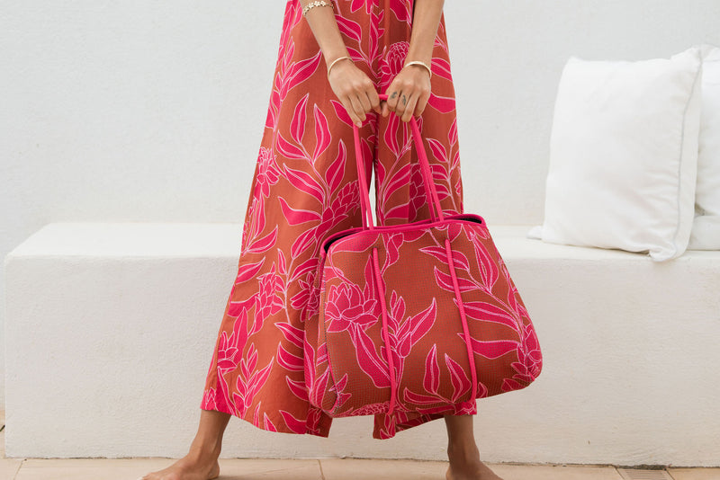large neoprene tote bag and matching pouch in rusty brown and pink awapuhi print 