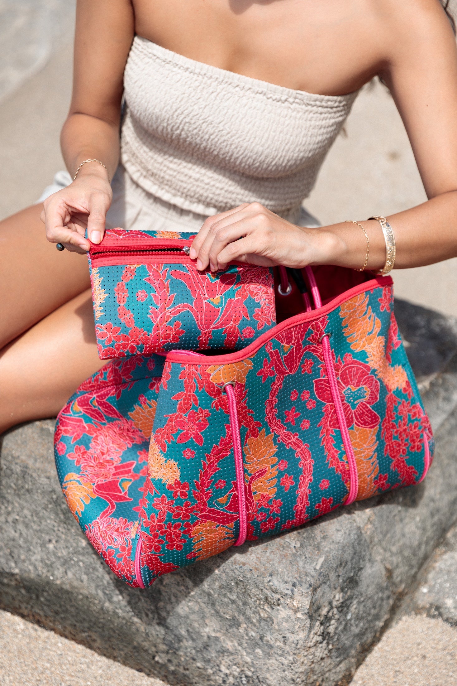 large rich blue neoprene tote bag with red and orange lei pattern