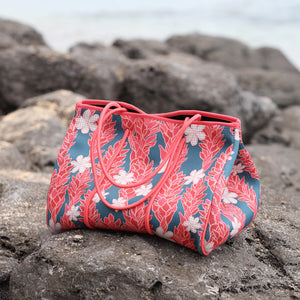 everyday tote bag made from neoprene featuring tiare and ginger flower on a teal background