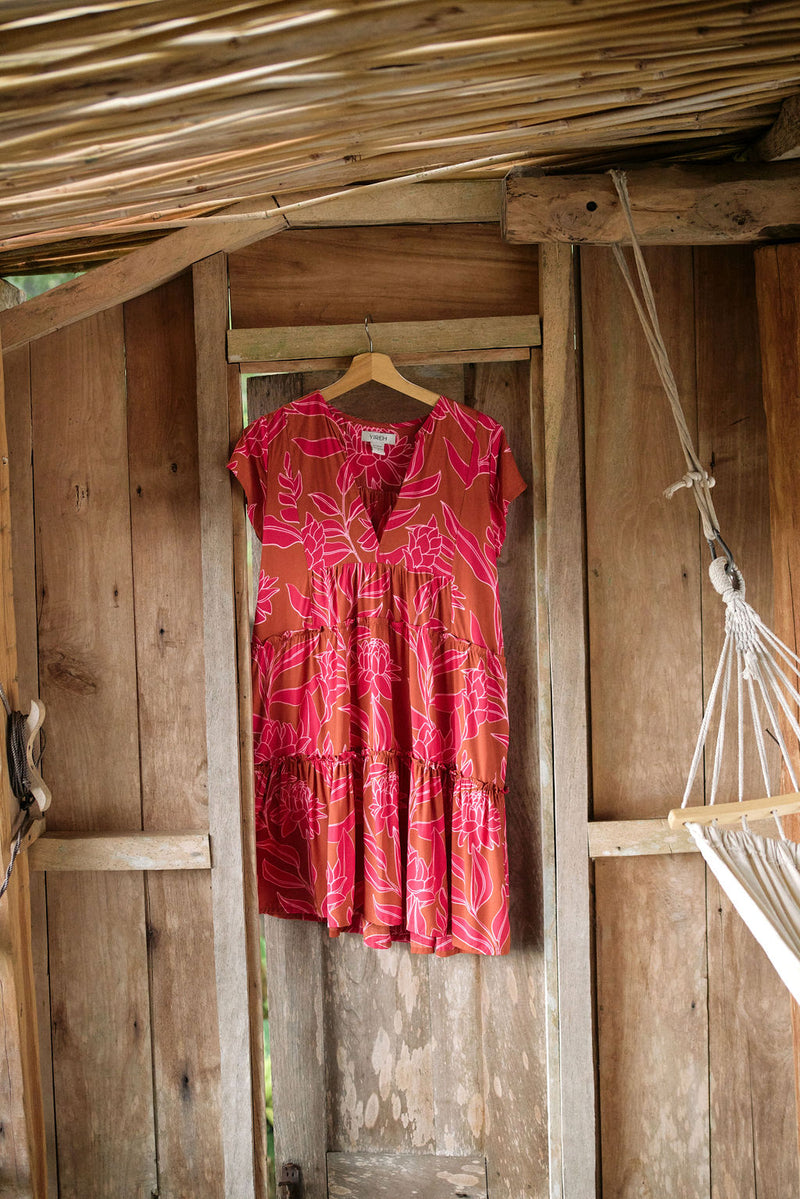 A YIREH tiered flowy dress. It is the Florentine Dress in the Garden 'Awapuhi print. 