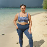 woman wearing a sports bra with blue hibiscus pattern
