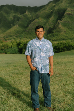 man wearing blue paisley printed aloha button up shirt