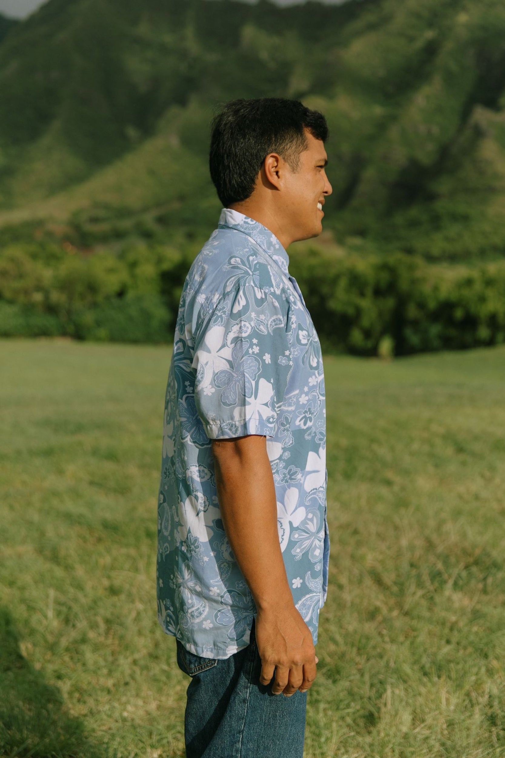 man wearing blue paisley printed aloha button up shirt