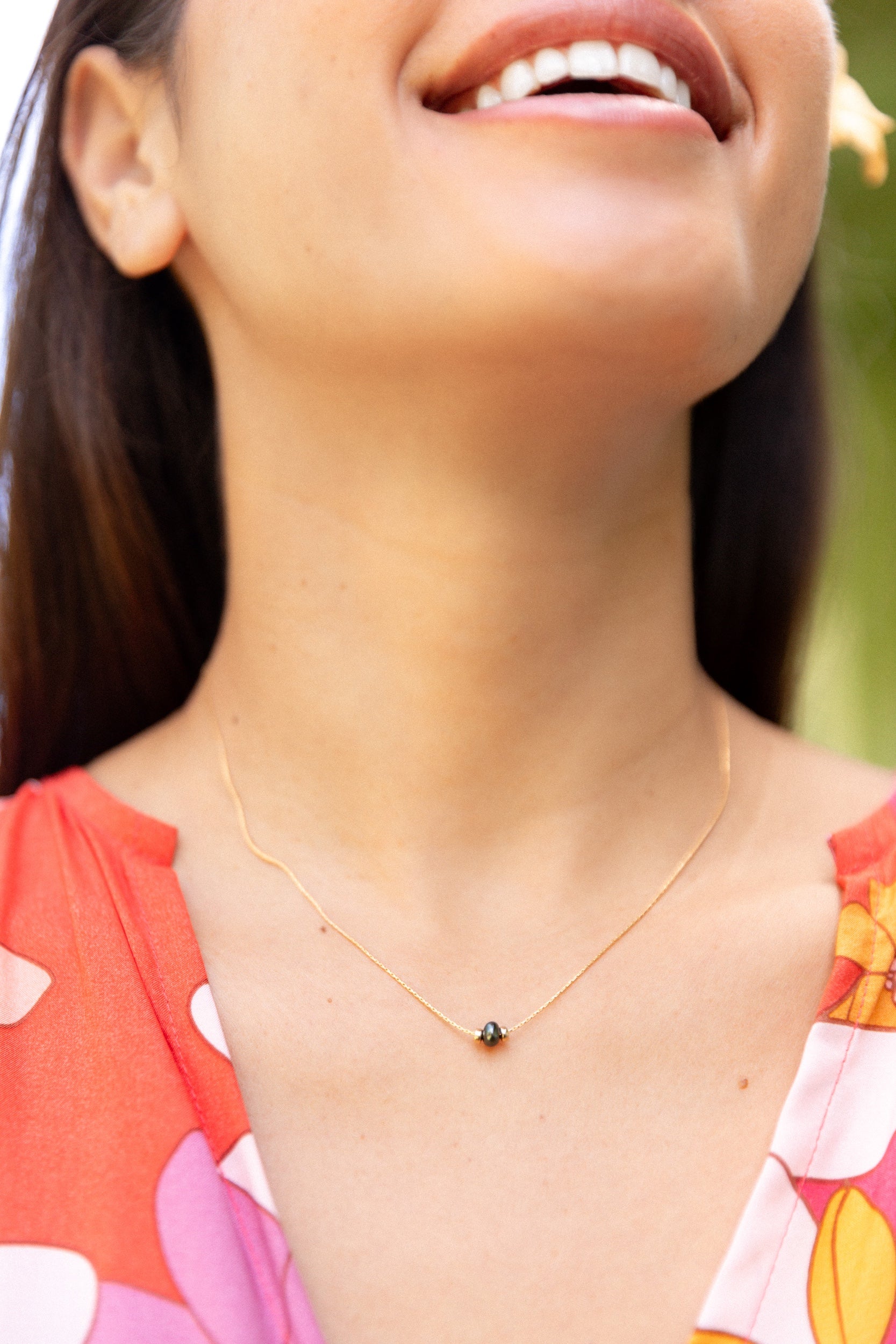 woman wearing keshi pearl snake chain necklace