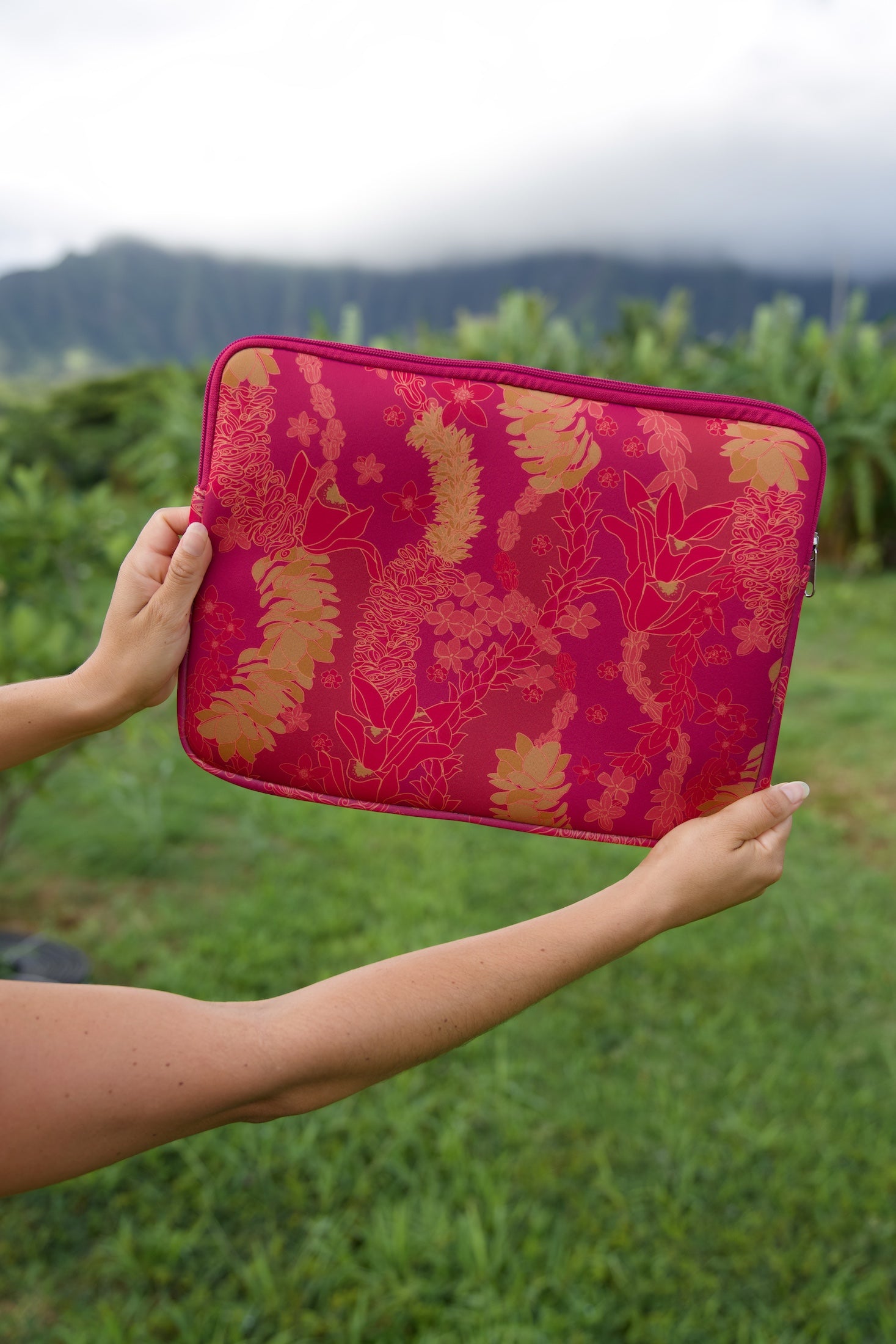 pink padded laptop case with lei print
