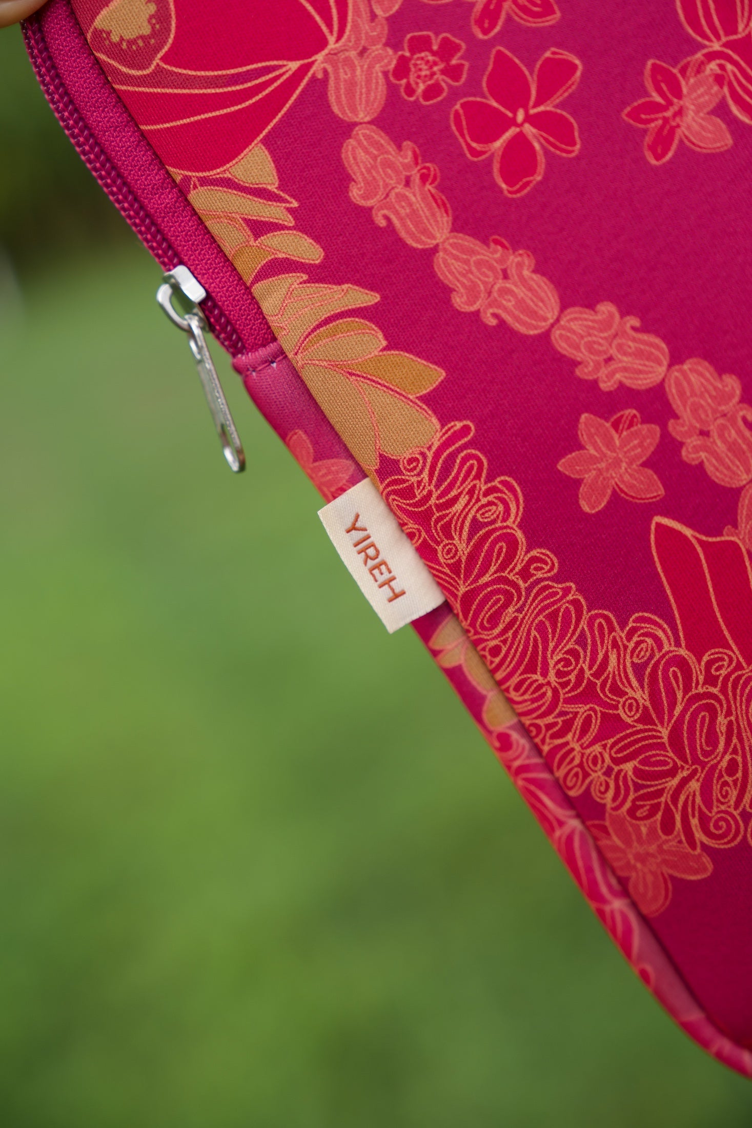 pink padded laptop case with lei print