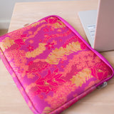 pink padded laptop case with lei print
