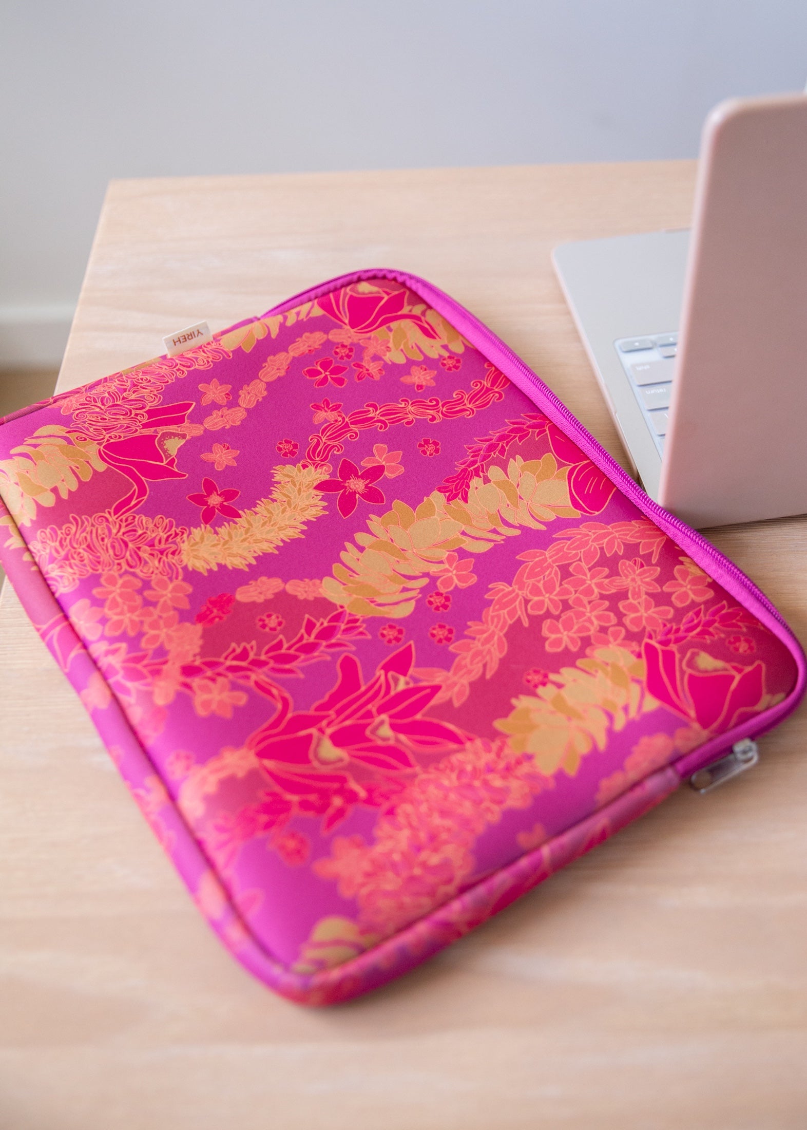 pink padded laptop case with lei print
