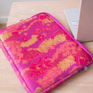 pink padded laptop case with lei print