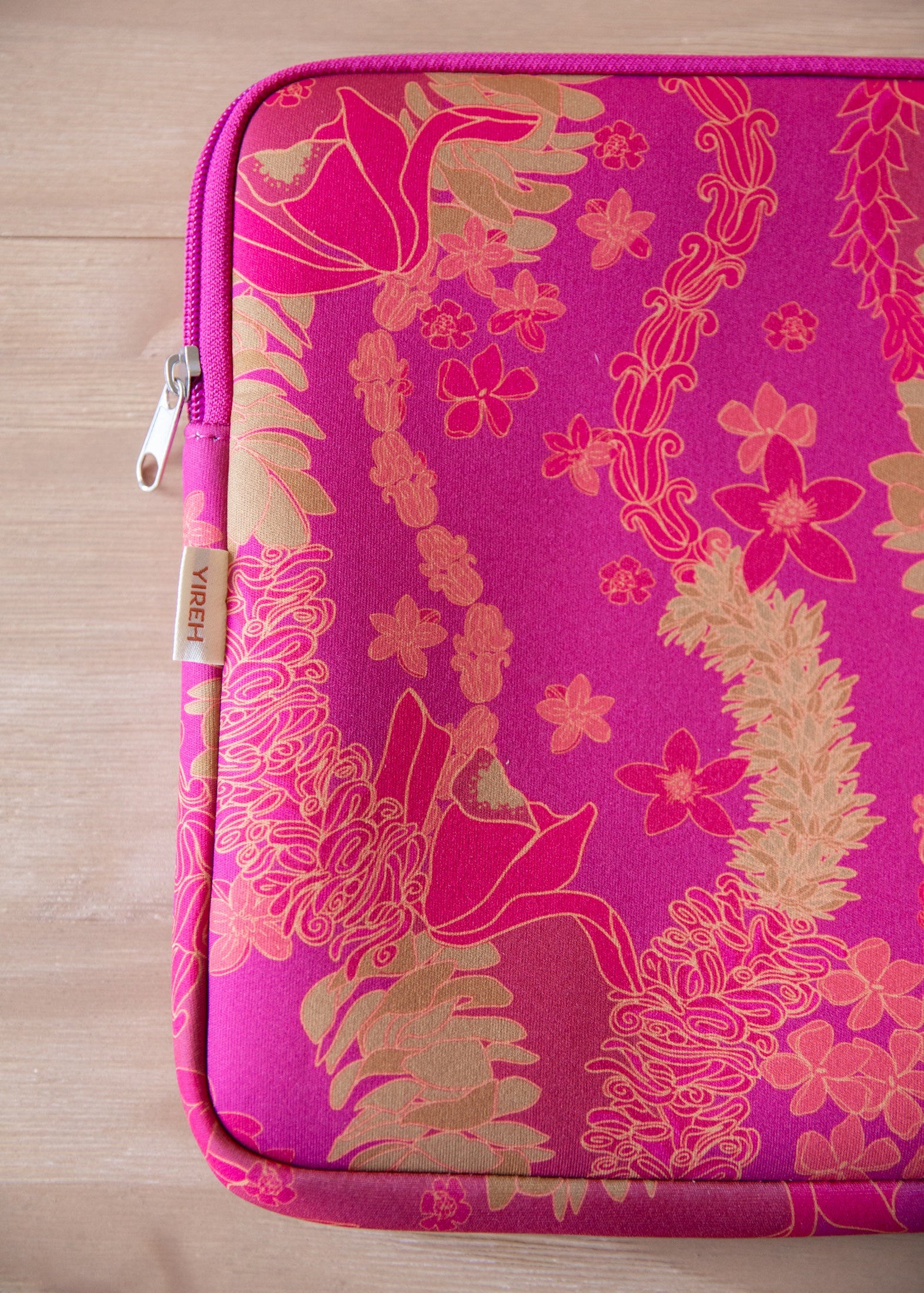 pink padded laptop case with lei print