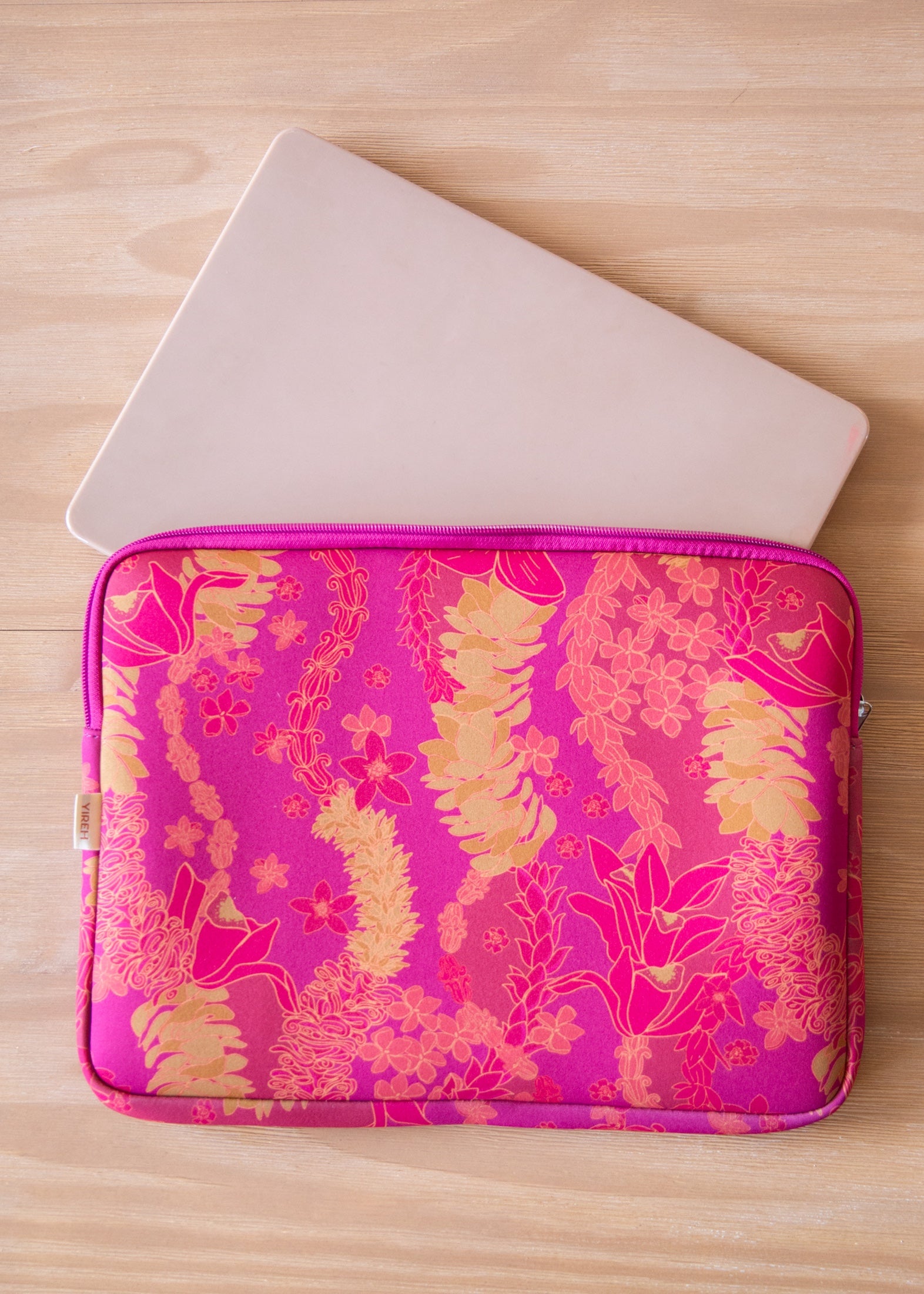 pink padded laptop case with lei print