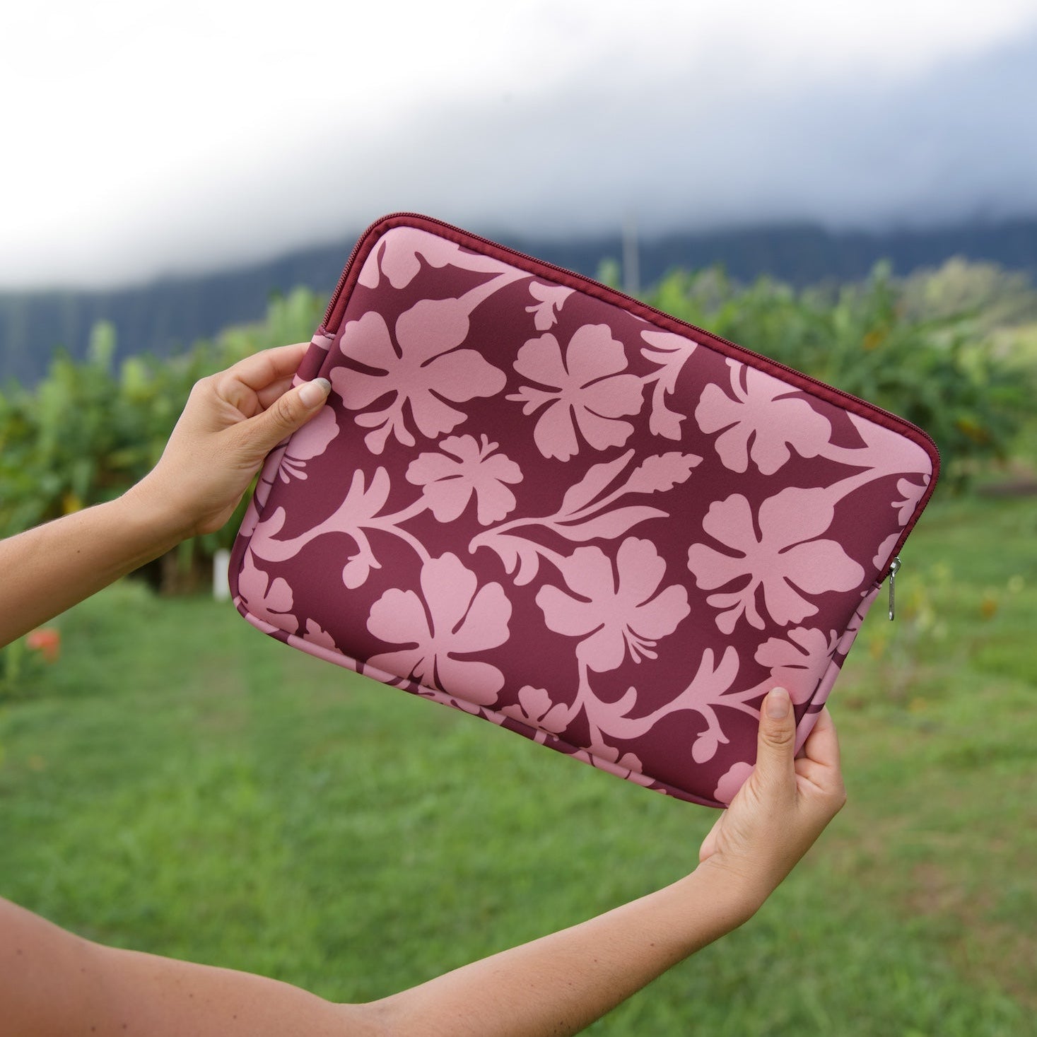 padded laptop case with pink and brown toned hibiscus print
