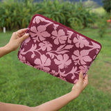 padded laptop case with pink and brown toned hibiscus print