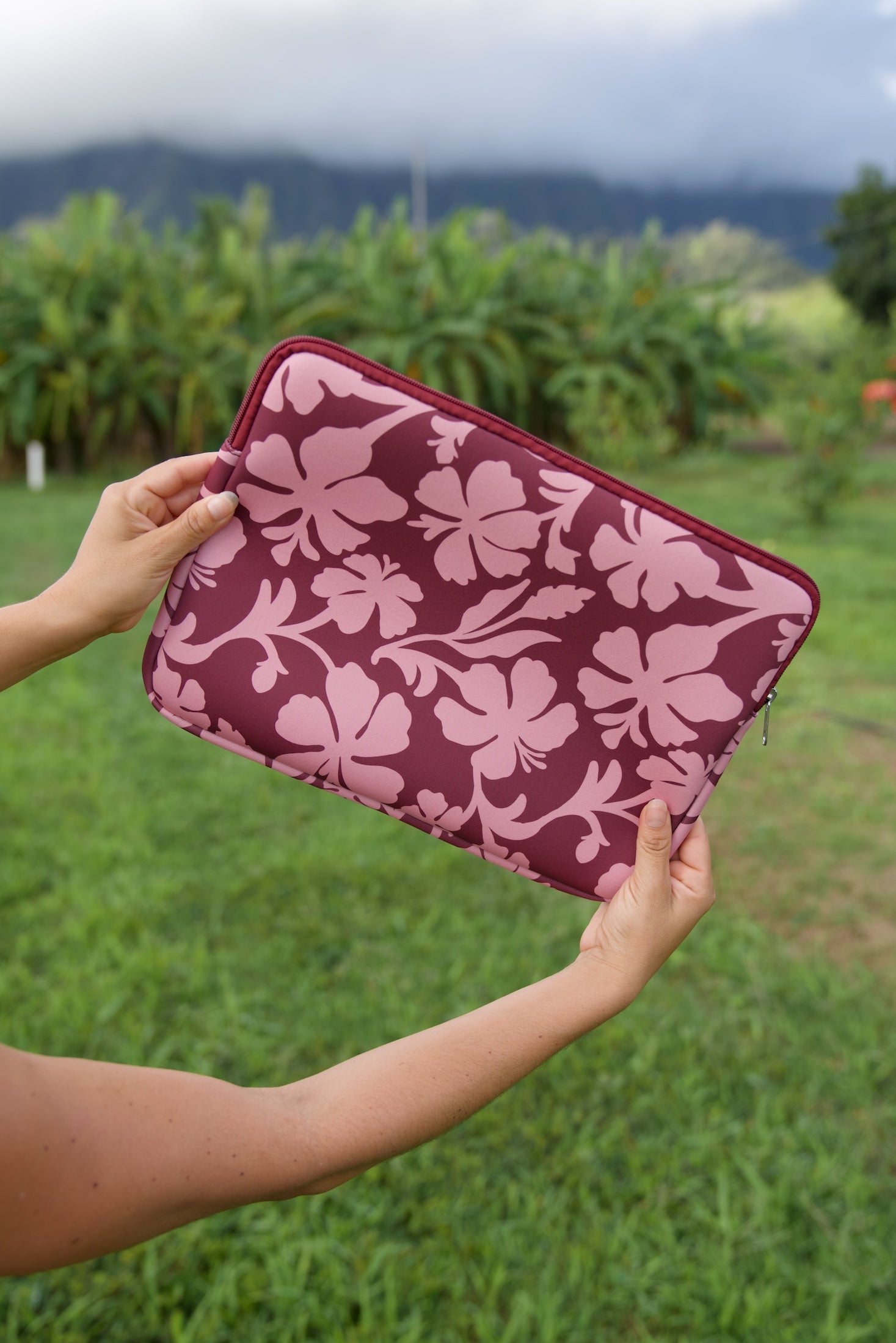padded laptop case with pink and brown toned hibiscus print