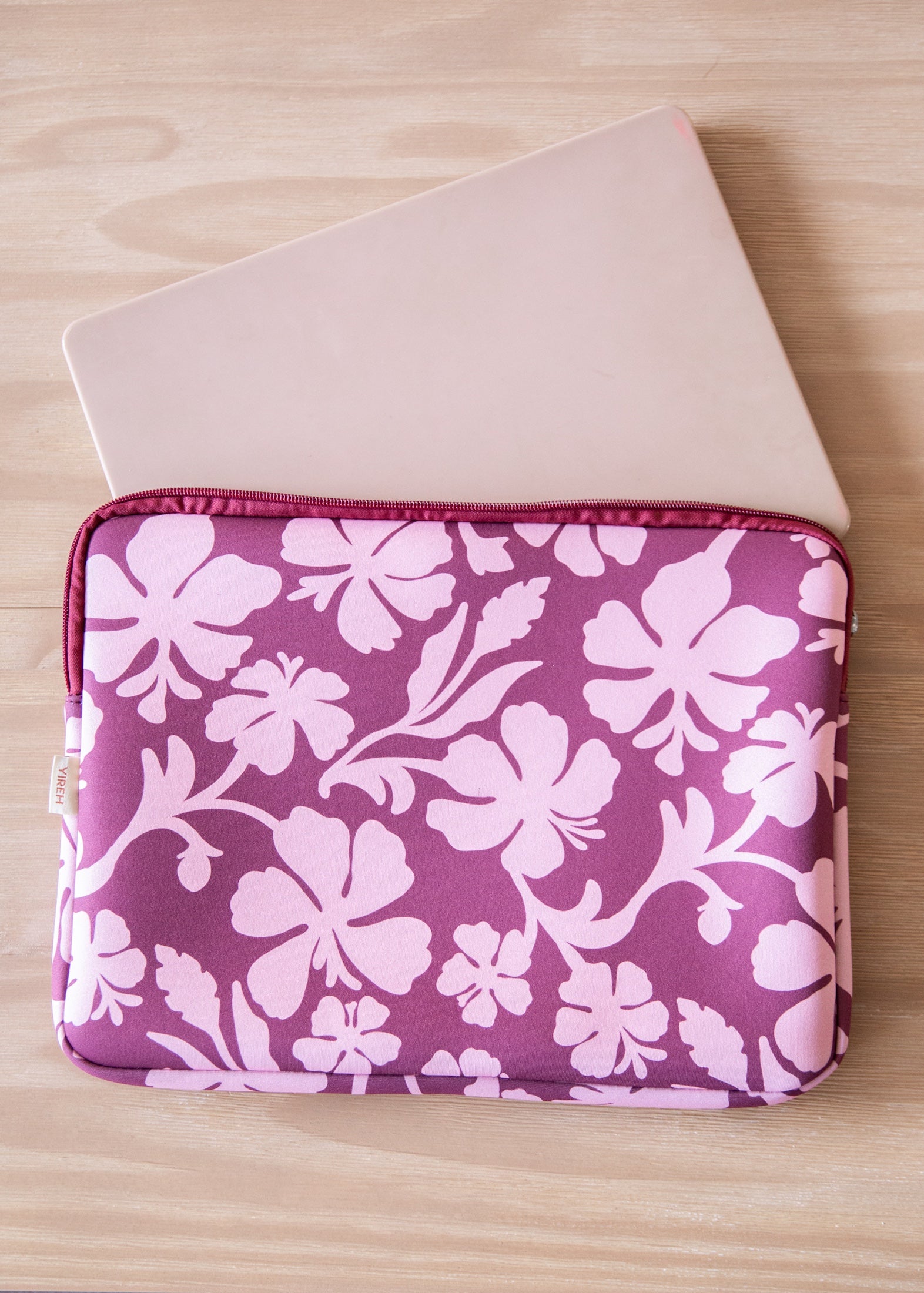 padded laptop case with pink and brown toned hibiscus print