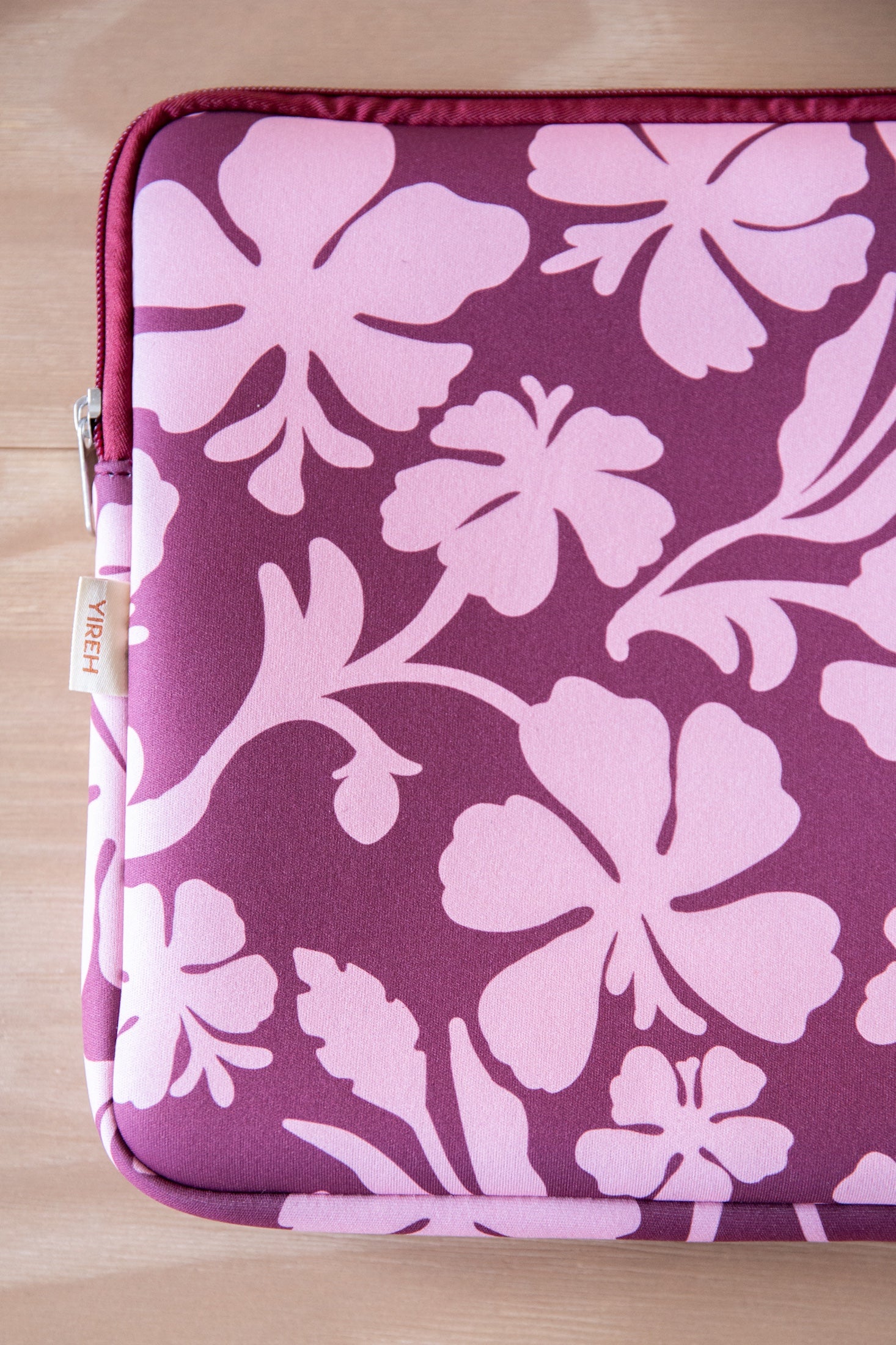 padded laptop case with pink and brown toned hibiscus print