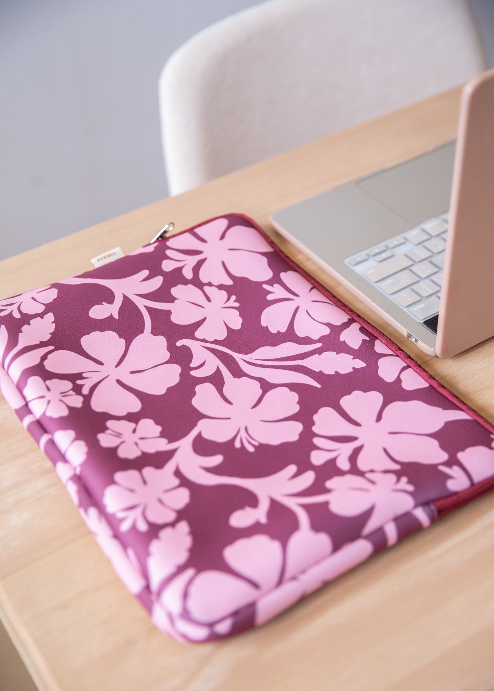 padded laptop case with pink and brown toned hibiscus print